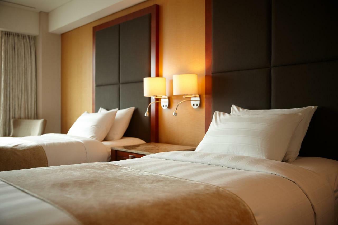 Lotte Hotel Busan Eksteriør bilde A bedroom